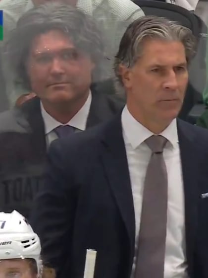 Jared Bednar lookalike sits behind Colorado coach in Dallas